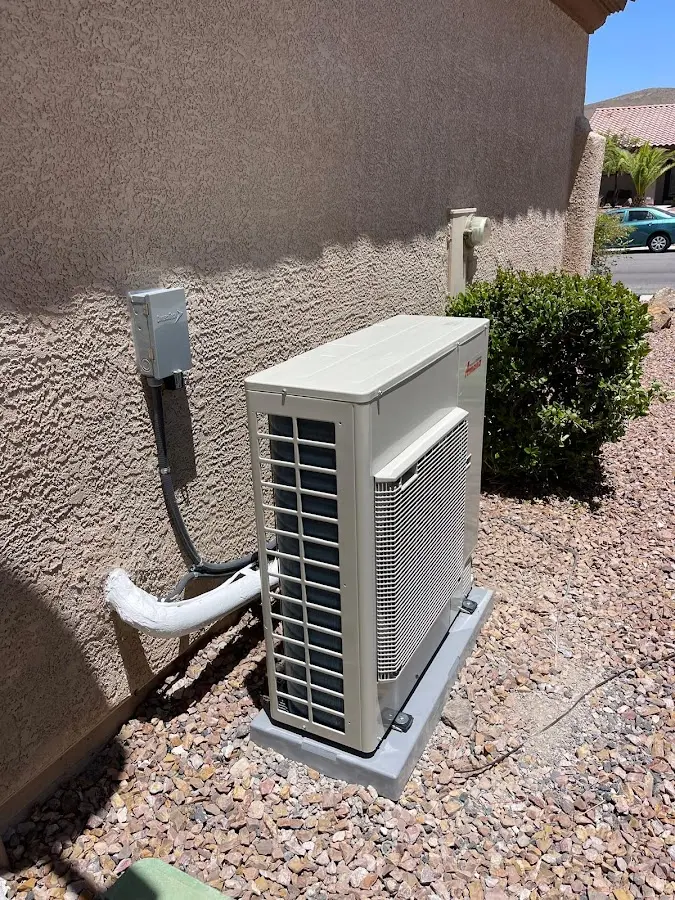 Residential air conditioning condenser unit in Troy